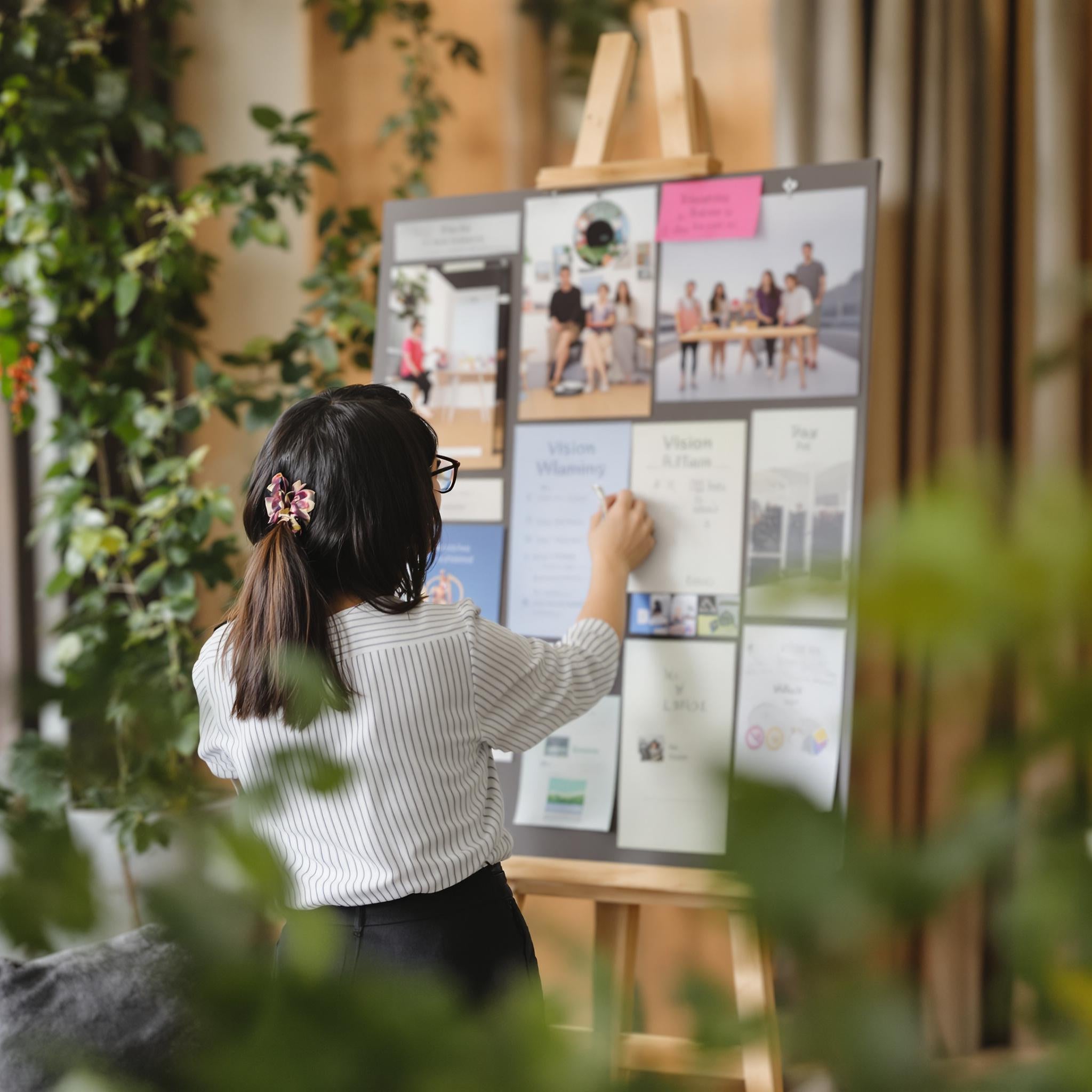 A girl doing vision planning in a planner