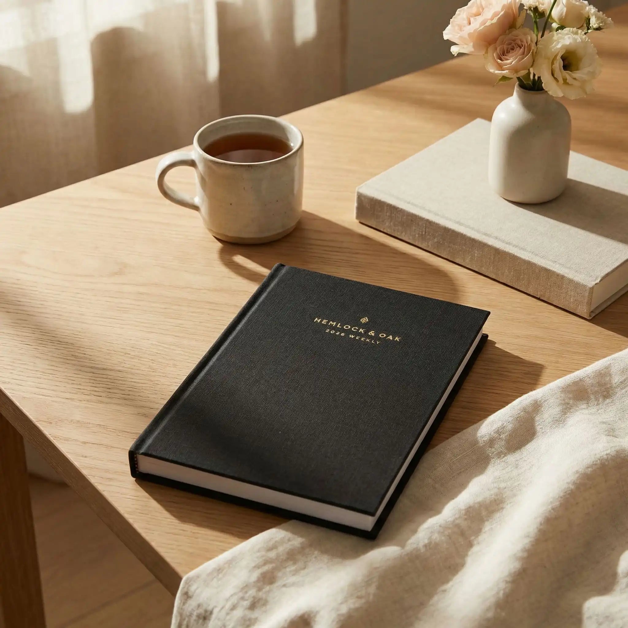 2026 Weekly Planner (Hardcover) in Charbon - interior spread #color_charbon