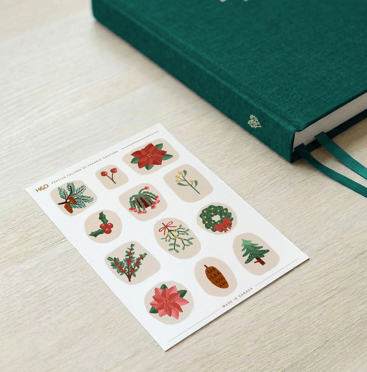 Festive Foliage sticker sheet by Frankie Couture shown beside a notebook with one of the stickers applied