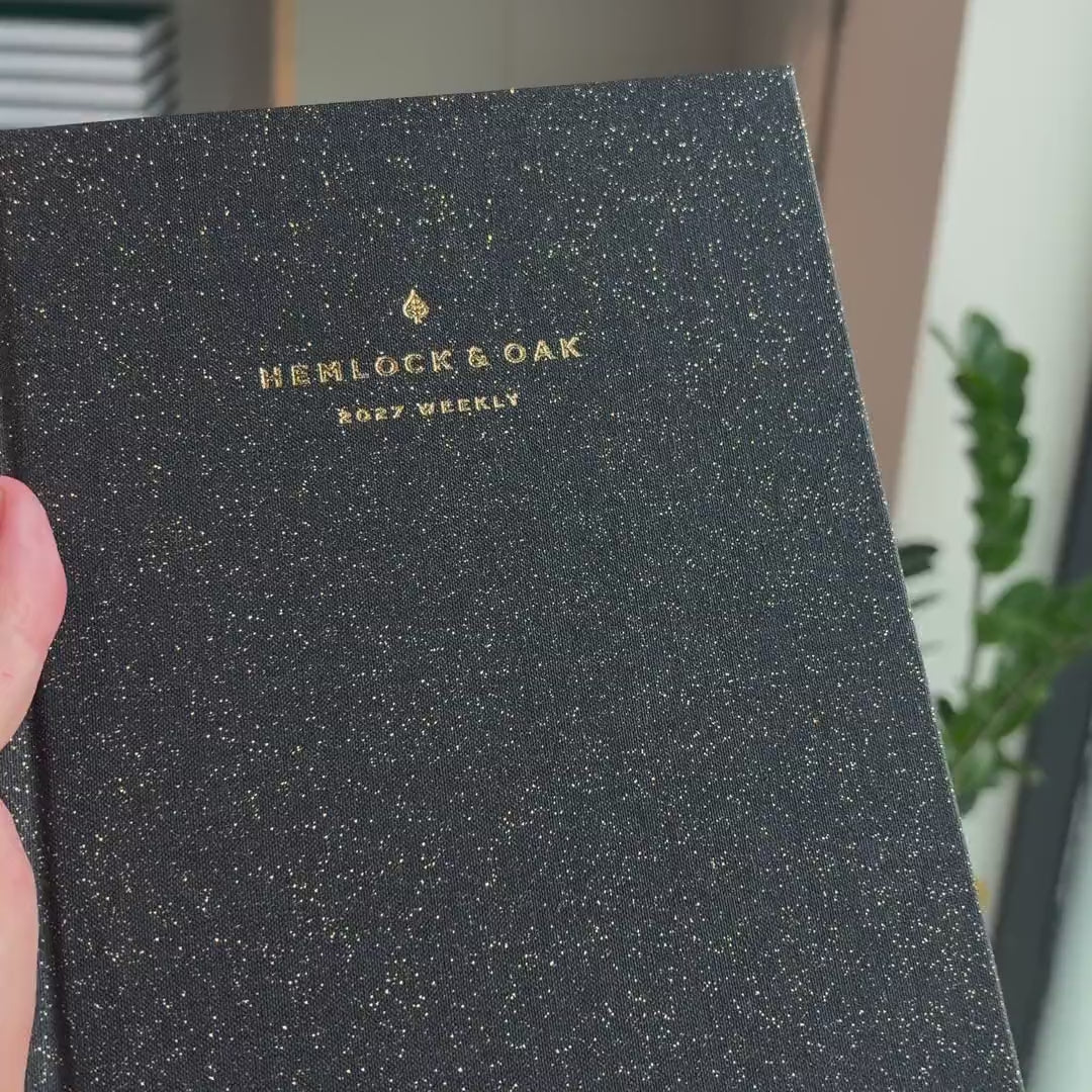 2027 Weekly Planner (Hardcover, Vertical, Heritage 120gsm, A5+) in Witching Hour, held in hand #color_witching hour