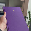 2027 B5 Minimalist Vertical Planner (Hardcover, Heritage 120gsm) in Aura, held in hand #color_aura