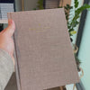2027 Signature Daily Planner (Hardcover, A5+, Archivist 70gsm) in Fawn, held in hand #color_fawn