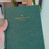 2027 Signature Daily Planner (Hardcover, A5+, Archivist 70gsm) in Enchanted Forest, held in hand #color_enchanted forest