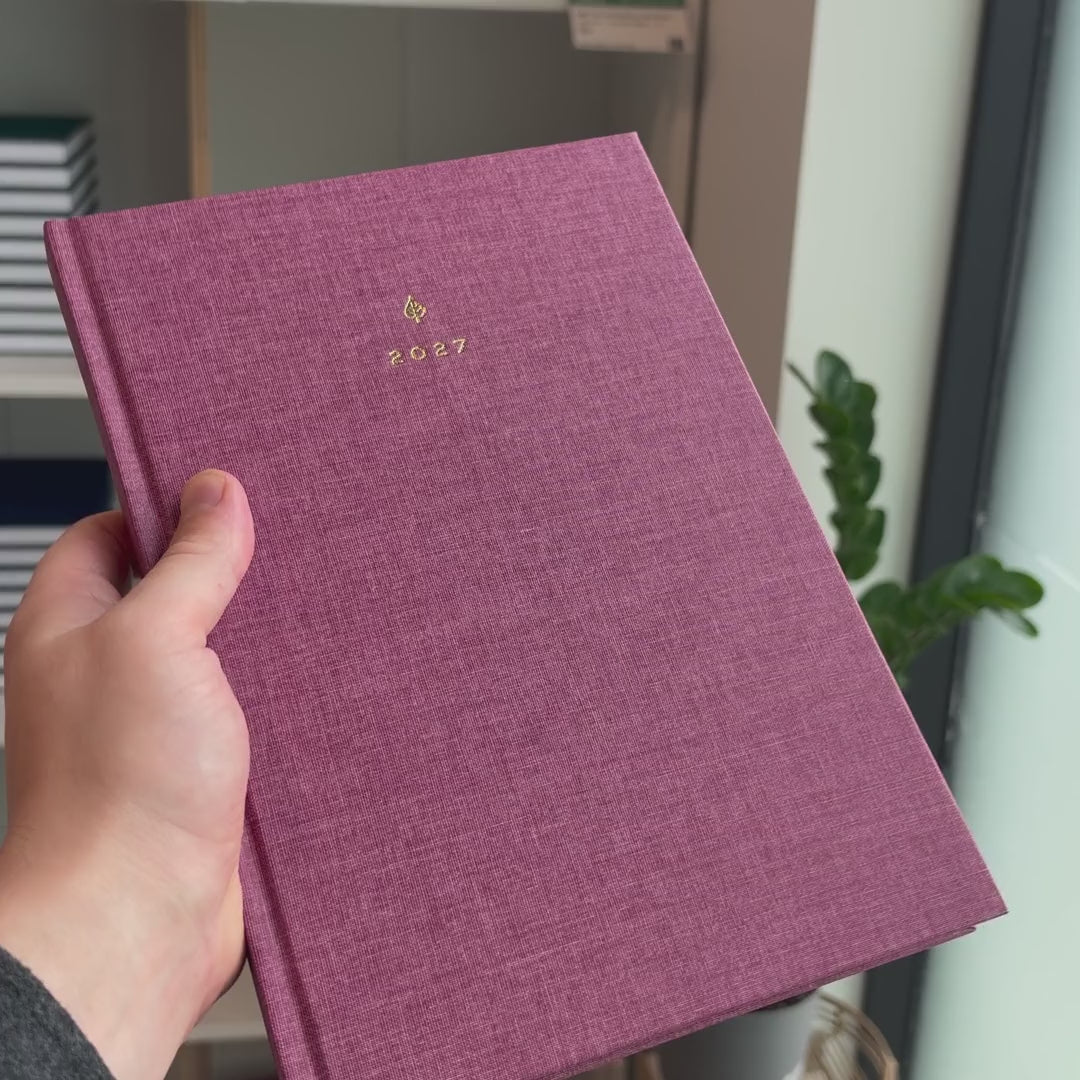2027 B5 Minimalist Vertical Planner (Hardcover, Heritage 120gsm) in Wild Rose, held in hand #color_wild rose