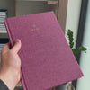 2027 B5 Minimalist Vertical Planner (Hardcover, Heritage 120gsm) in Wild Rose, held in hand #color_wild rose