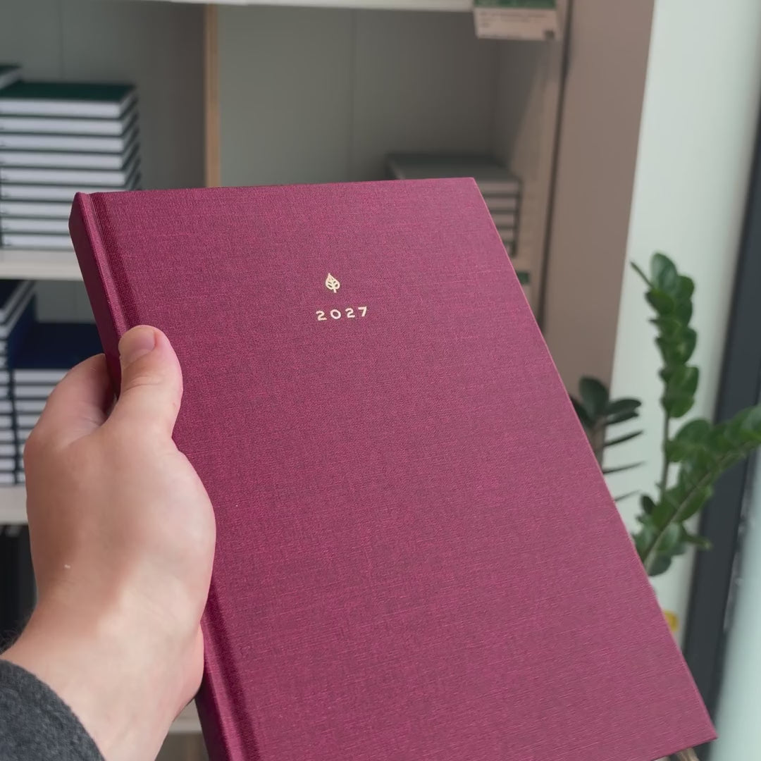 2027 B5 Minimalist Vertical Planner (Hardcover, Heritage 120gsm) in Scarlet Oak, held in hand #color_scarlet oak