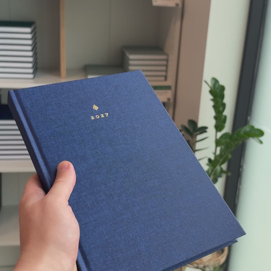 2027 B5 Minimalist Vertical Planner (Hardcover, Heritage 120gsm) in Empress, held in hand #color_empress