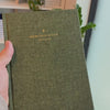 2027 Signature Daily Planner (Hardcover, A5+, Archivist 70gsm) in Moss, held in hand #color_moss