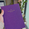 2027 Signature Daily Planner (Hardcover, A5+, Archivist 70gsm) in Aura, held in hand #color_aura