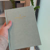 2027 Signature Daily Planner (Hardcover, A5+, Archivist 70gsm) in Moonflower, held in hand #color_moonflower