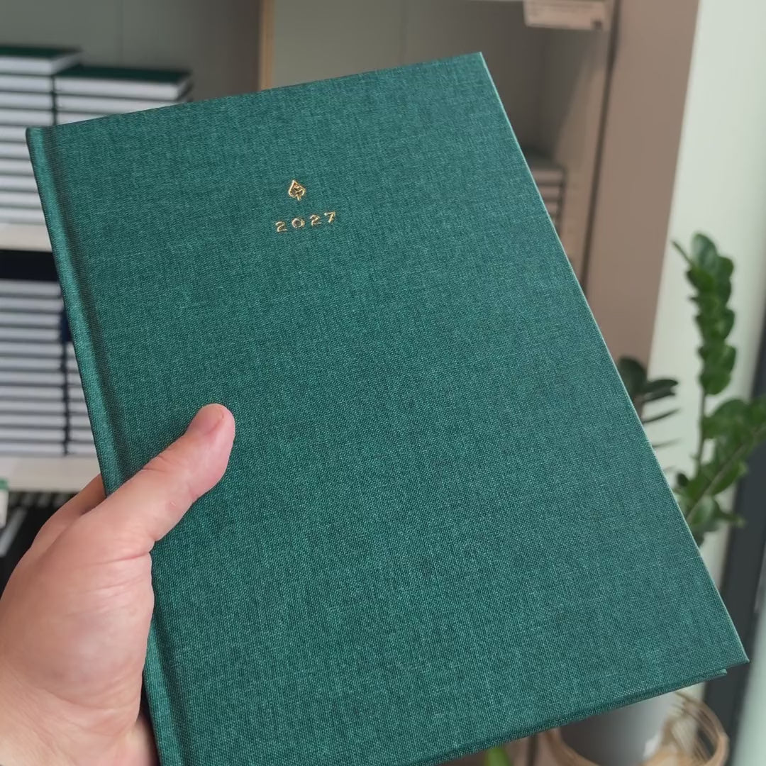 2027 B5 Minimalist Vertical Planner (Hardcover, Heritage 120gsm) in Enchanted Forest, held in hand #color_enchanted forest