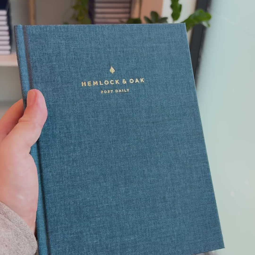2027 Signature Daily Planner (Hardcover, A5+, Archivist 70gsm) in Rivière, held in hand #color_riviere #color_rivière