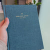 2027 Signature Daily Planner (Hardcover, A5+, Archivist 70gsm) in Rivière, held in hand #color_riviere #color_rivière