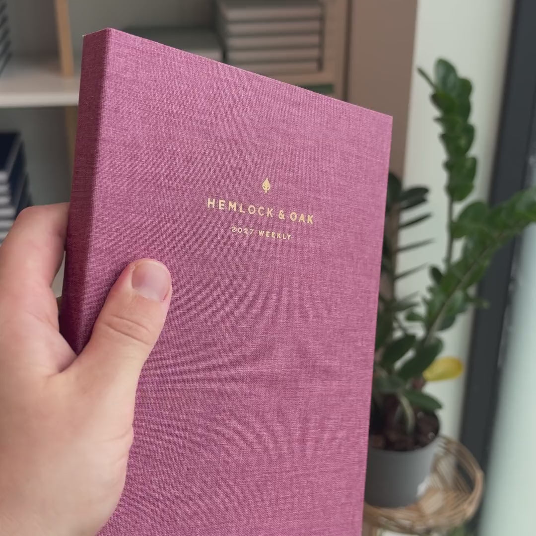 2027 Sunday Start Weekly Planner (Cloth Flex, Heritage 120gsm, A5+) in Wild Rose, held in hand #color_wild rose