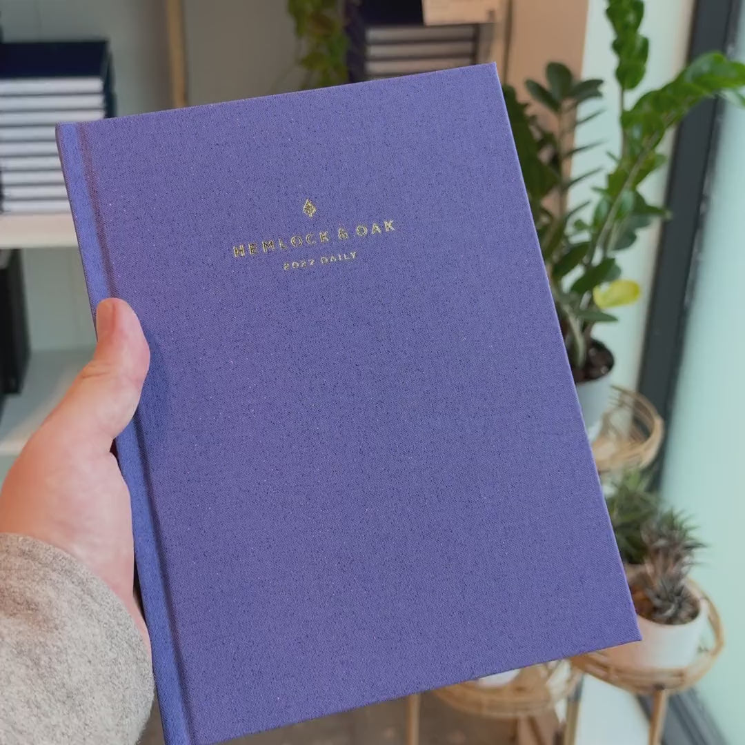 2027 Signature Daily Planner (Hardcover, A5+, Archivist 70gsm) in Fae, held in hand #color_fae