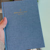 2027 Signature Daily Planner (Hardcover, A5+, Archivist 70gsm) in Spring, held in hand #color_spring