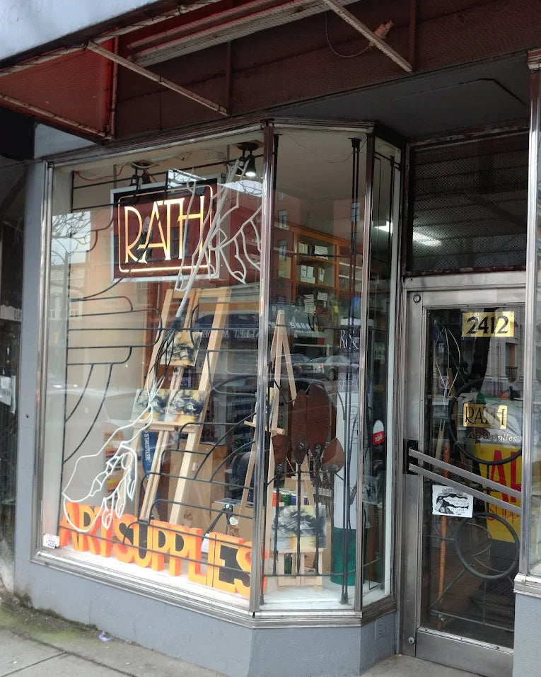 Storefront with a neon sign and glass window display